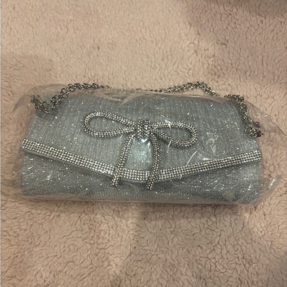 Silver Sparkle Evening Clutch with Chain Strap and Rhinestone Bow and Trim